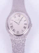 Universal Geneve, a ladies 18ct white gold Universal Geneve manual wind wristwatch, oval Roman dial,