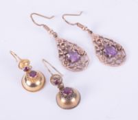 Two pairs of earrings to include a pair of 9ct gold ornate flower designed drops set with a