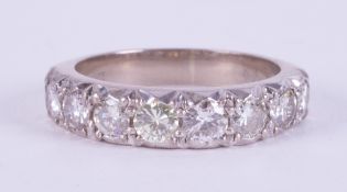 An 18ct white gold ring set with eight round brilliant cut diamonds, approximate total