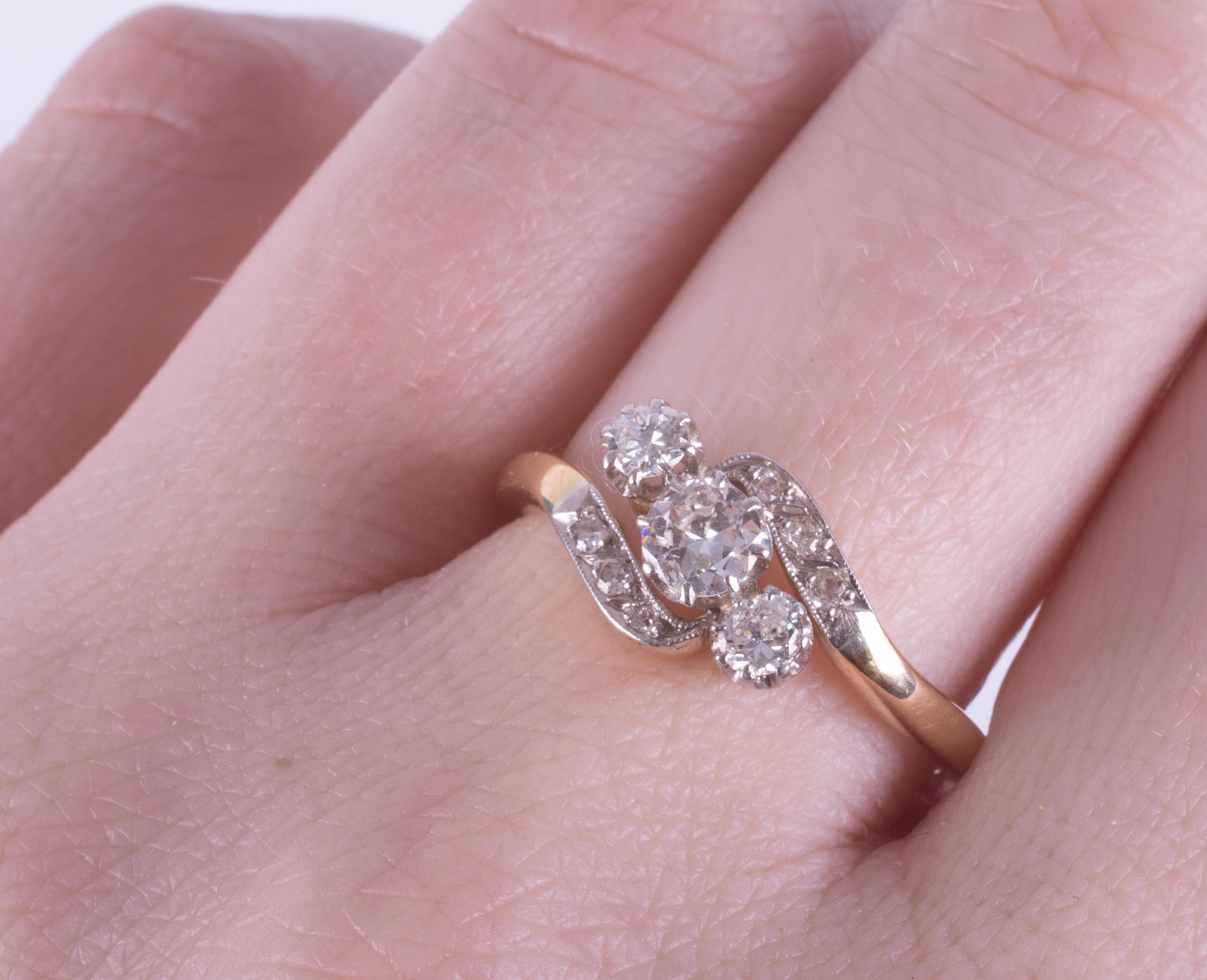 An 18ct yellow gold & platinum crossover style ring set with three round brilliant cut diamonds - Image 2 of 2