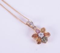 A 9ct yellow gold flower pendant set with oval cut multicolour sapphires and a tiny round