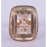 An impressive & ornate 9ct rose & yellow gold seal ring set with a pale yellow citrine engraved with