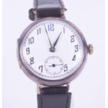 A silver 'trench' style wrist watch, mechanical hand wind movement, classic arabic 1920 style,