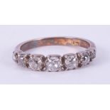 An 18ct yellow & white gold Victorian ring set with seven old cut diamonds, approx. total diamond