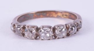 An 18ct yellow & white gold Victorian ring set with seven old cut diamonds, approx. total diamond
