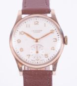 J.W. Benson, a 9ct yellow gold cased wrist watch with brown leather strap, arabic/second subs