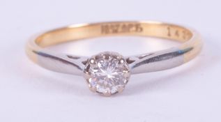 An 18ct yellow gold & platinum diamond solitaire ring, approx. 0.21 carats, 2.13gm, size M.