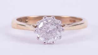 An 18ct yellow & white gold solitaire ring set with approx. 1.02 carats of round brilliant cut