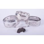 A selection of items include a pair of silver cufflinks, 7.11gm, and four silver engraved bangles,