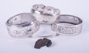 A selection of items include a pair of silver cufflinks, 7.11gm, and four silver engraved bangles,