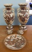 A pair of large Japanese Satsuma vases, height 53cm, together with a wall plate and a pair of
