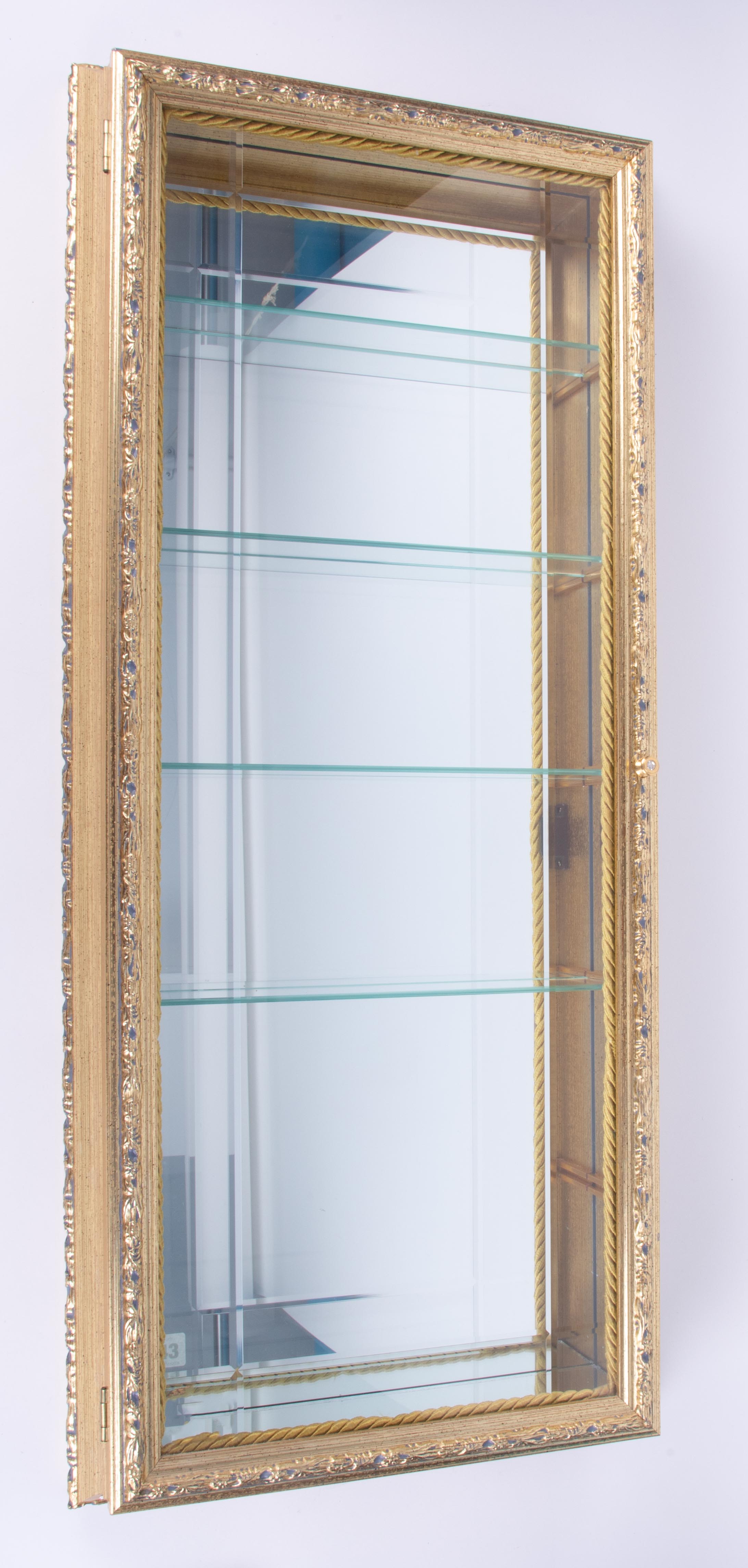A modern gilt display cabinet, height 88cm, width 38cm.