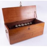 An antique cylinder music box with rack of six bells, cylinder 14 inches, damage to the comb,
