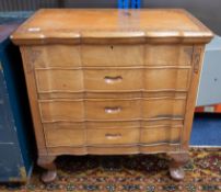 A sewing cabinet with fitted interior and three drawers containing a quantity of various sewing