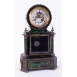 An ebonised and green marble effect French mantel clock, the dial escapement window inscribed H.