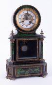 An ebonised and green marble effect French mantel clock, the dial escapement window inscribed H.
