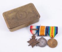 A WWI Princess Mary Christmas Tin and a trio of medals awarded to Private W. Middleton, Liverpool