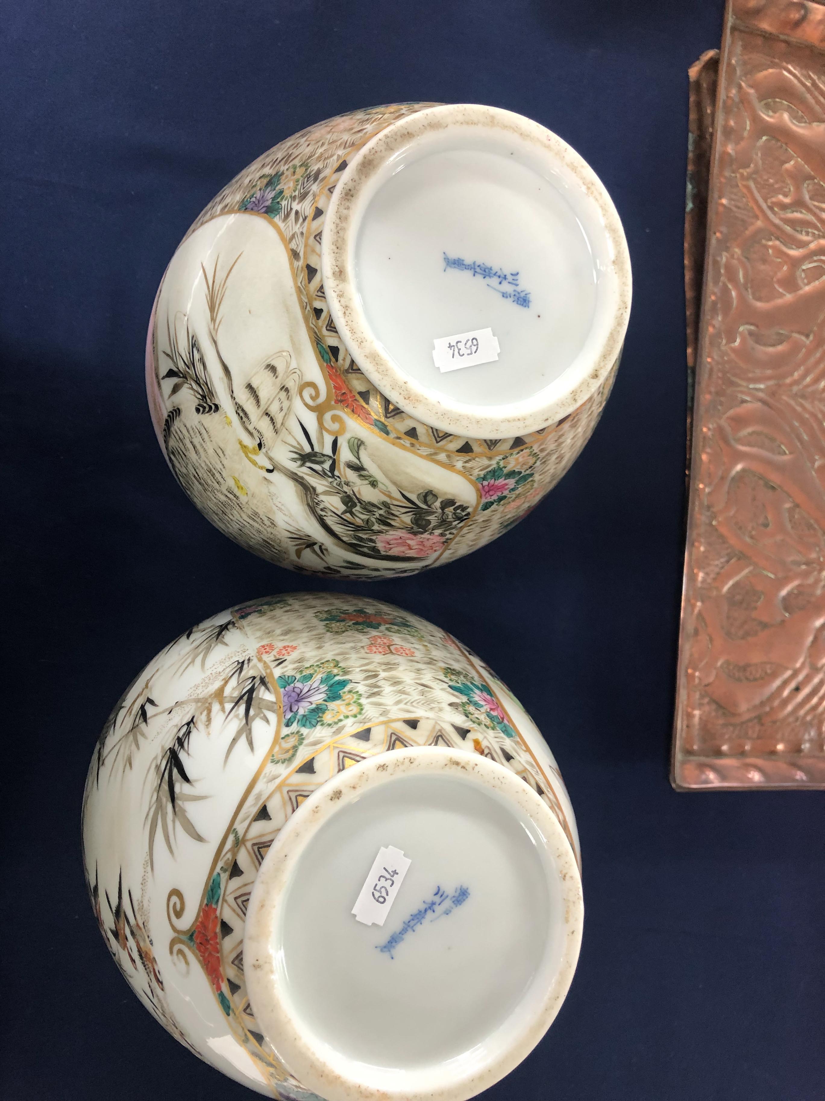 A pair of Oriental porcelain vases decorated with figures and exotic birds with a signed base, - Image 6 of 7