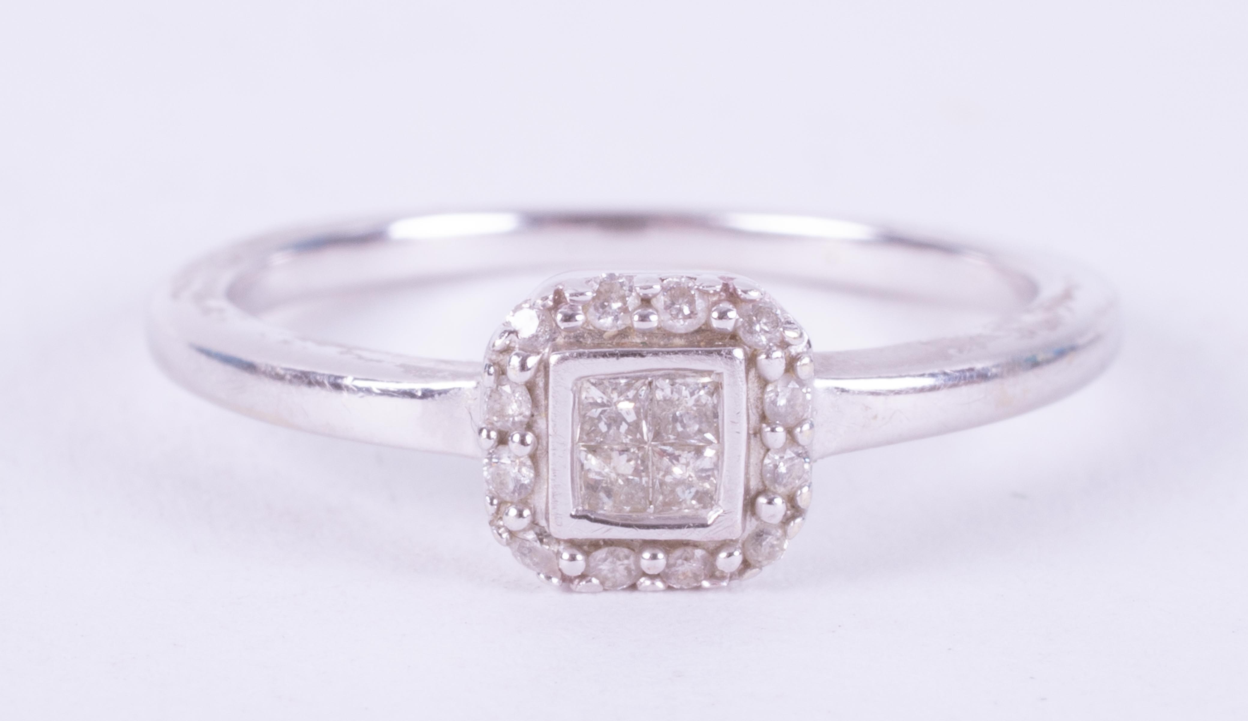 A 9ct white gold square cluster style ring set with a mixture of princess cut and round brilliant