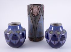 A pair of Doulton art pottery vases, circa 1902, impress marks, height 17cm, together with William
