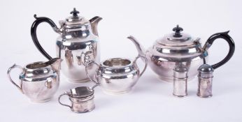 A four piece silver plated tea service, together with a three piece condiment set.