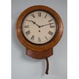 A Victorian mahogany cased dial clock, with key and pendulum.