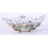 A 19th Century Italian porcelain pierced basket decorated with flowers and gilt work, impressed