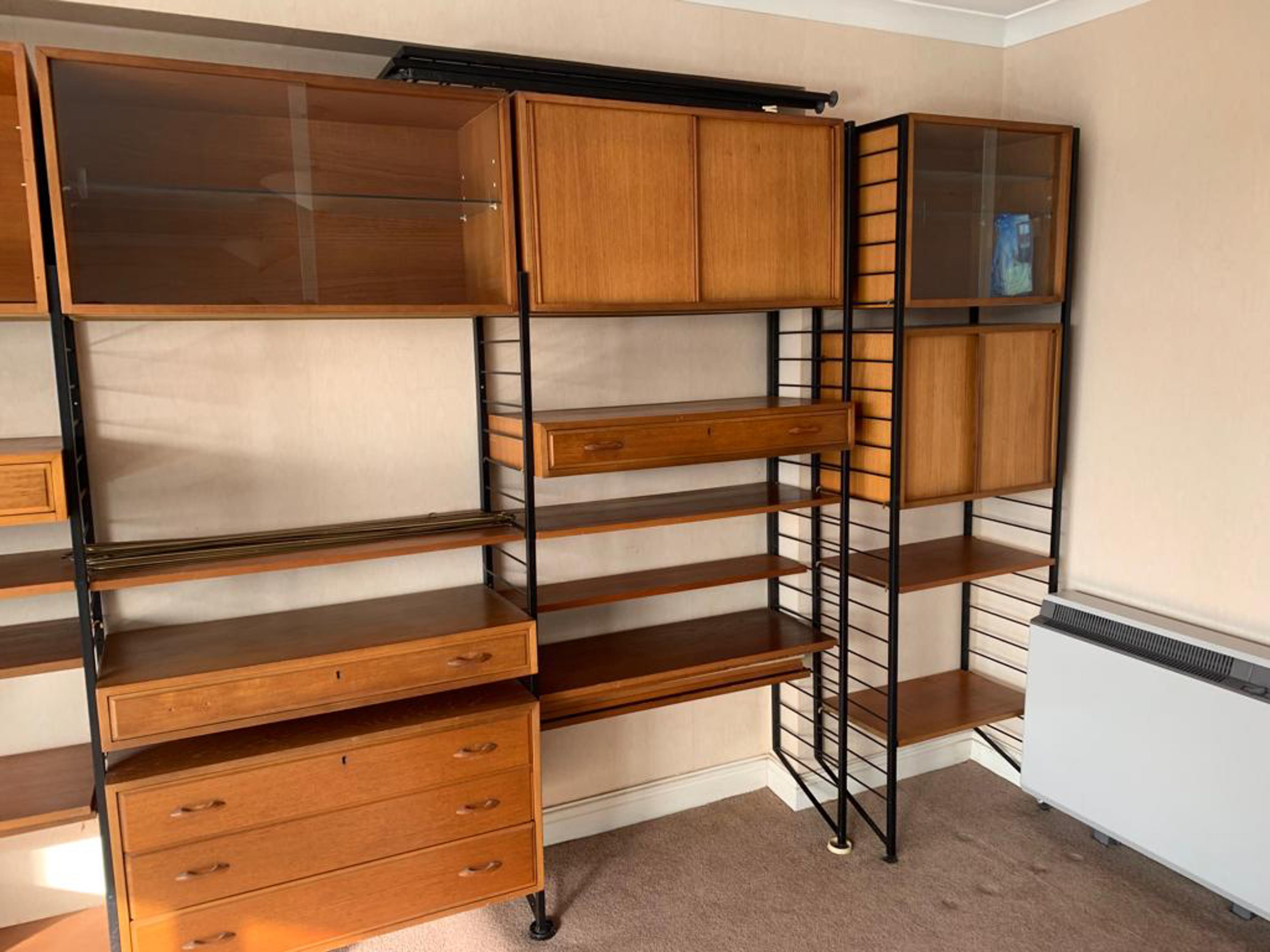 Staples Ladderax, a group of 20th century teak and black tubular steel shelving units, five tall