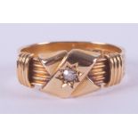 An 18ct yellow gold antique ring set with a central old cut diamond, hallmarked Birmingham, letter m