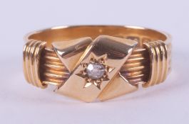 An 18ct yellow gold antique ring set with a central old cut diamond, hallmarked Birmingham, letter m