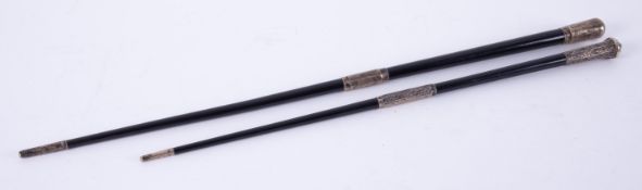 Two antique silver mounted and ebonised conductors batons, the longest 52cm.