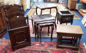 An oak and barley twist plant stand, two nests of tables, small mahogany occasional table and an oak