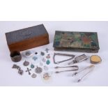 An oak and pewter box containing various items of costume jewellery, medallions and another box