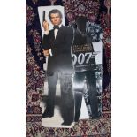 Various James Bond 007 cinema standing props including Pierce Brosnan.