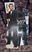 Various James Bond 007 cinema standing props including Pierce Brosnan.