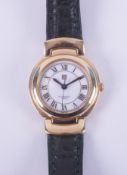 Givenchy Paris, a ladies Givenchy wristwatch with a gold tone case, stamped on the backplate '