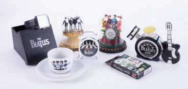 Small collection of Beatles memorabilia including a stainless steel wristwatch, small alarm clock,