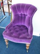 A Victorian chair with purple fabric.