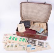 A large suitcase collection of cigarette cards in albums and loose, 59 albums.