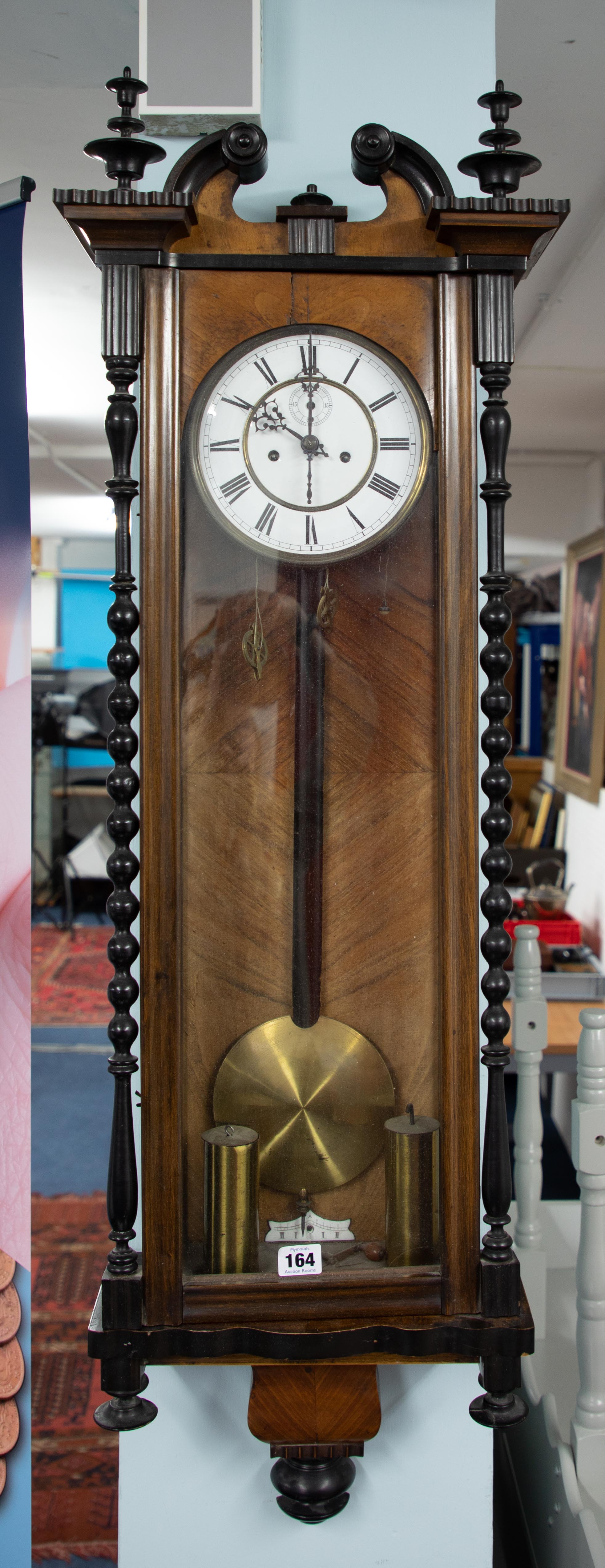 A Vienna type walnut and mahogany cased wall clock, with train movement, swan neck pediment,