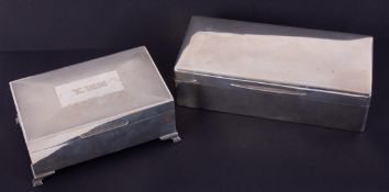 A silver rectangular cigarette box, 19cm x 9cm, together with another marked W.T.T & Co with