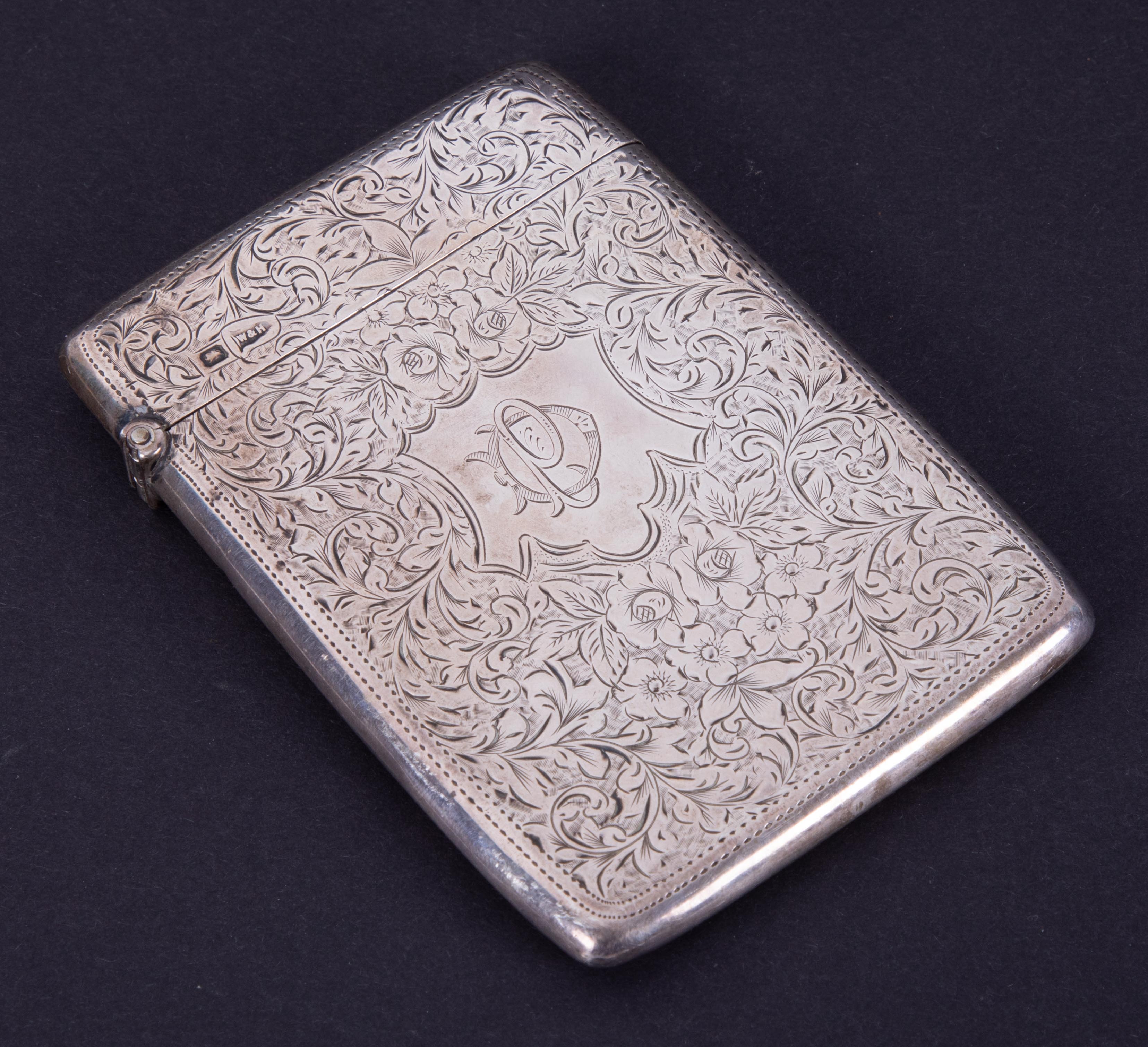 A Walker & Hall Geo.V silver card case with engraved decoration and monogrammed cartouche, approx.