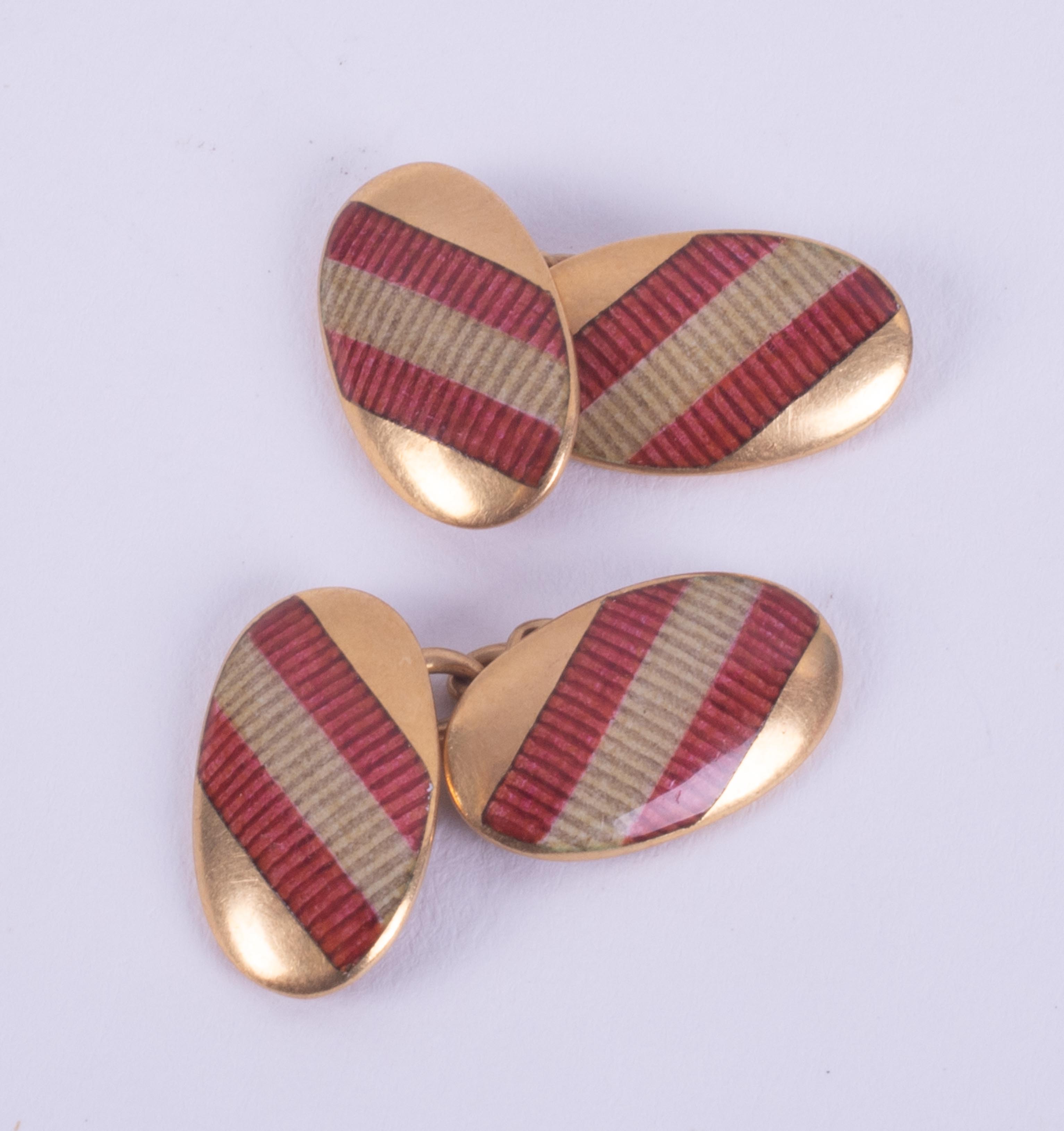 A pair of 18ct yellow gold oval chain link cufflinks with red striped design enamelling, length of