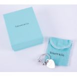 A silver Tiffany & Co heart keyring, the heart is stamped 925, 'Please Return To Tiffany & Co.,