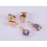 A pair of 18ct yellow gold drop earrings each set with an oval cut tanzanite, total weight of