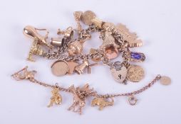Two charm bracelets to include a 9ct yellow gold charm bracelet with six 9ct yellow gold charms