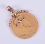 A gold coin pendant, on the front of the coin is Edward VII Crowned 9 August 1902 set with tiny