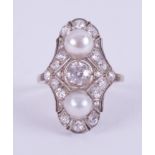An Art Deco 1930's white gold (not tested or hallmarked) ring set with two 6.5mm white pearls, a