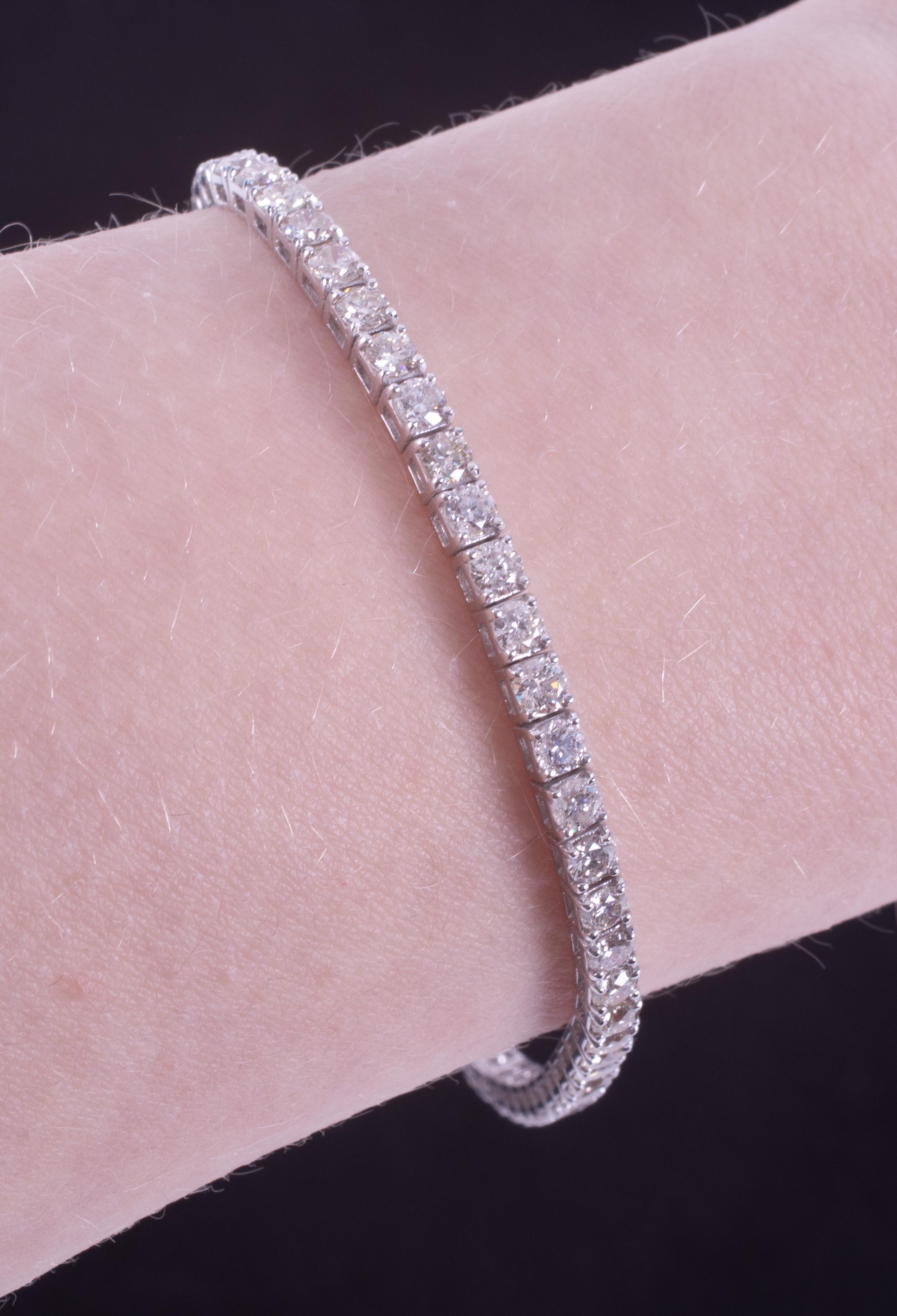An 18ct white gold line bracelet set with approx. 5.15 carats of round brilliant cut diamonds, - Image 3 of 3