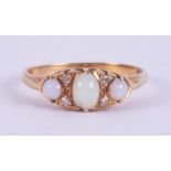 An 18ct yellow gold antique ring set with a central oval cabochon cut opal measuring approx. 55mm